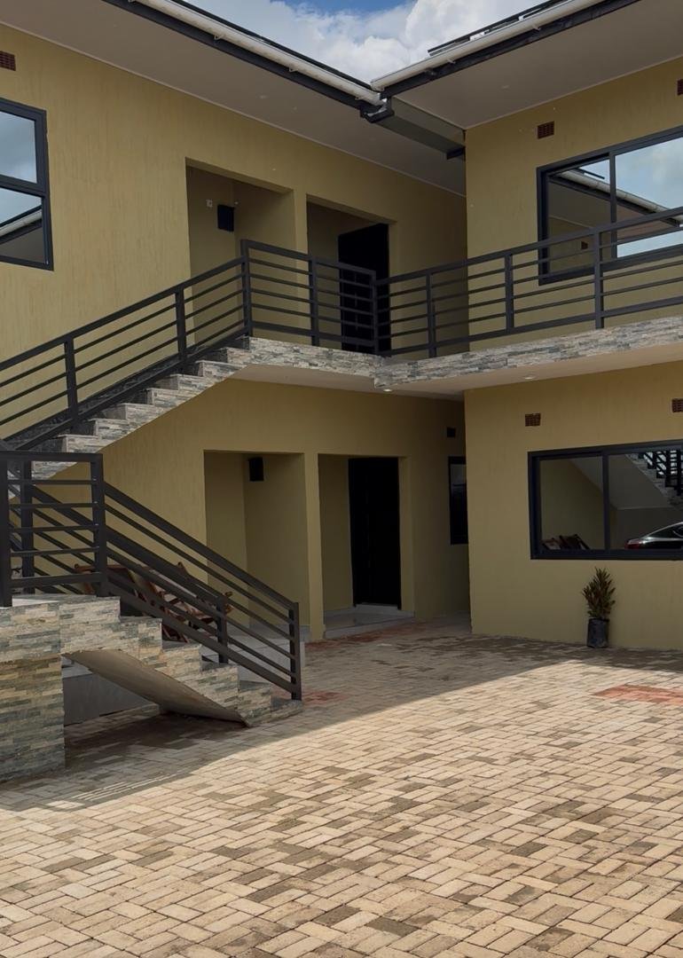 Lodge courtyard with stairs and balcony railings